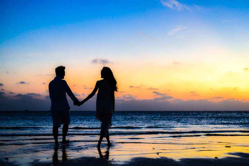 couple walking in a beach